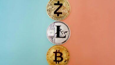 Colorful display of Zcash, Litecoin, and Bitcoin coins on gradient background.