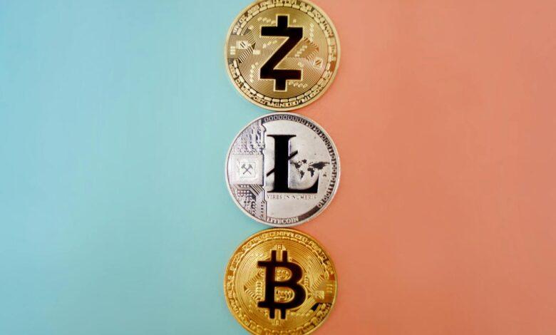 Colorful display of Zcash, Litecoin, and Bitcoin coins on gradient background.