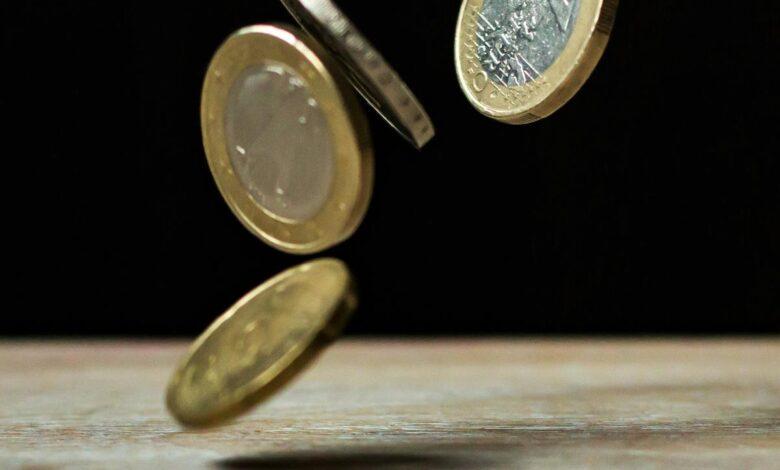 Dynamic shot of euro coins appearing to float, symbolizing active economy.