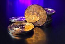 a pile of bitcoins sitting on top of a table