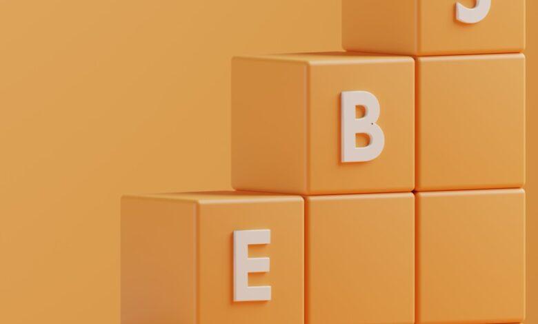 a 3d rendering of a pyramid of blocks with the letters e, b, e