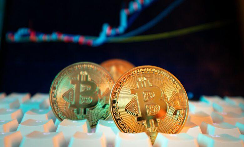 Bitcoin coins are displayed with a stock chart.