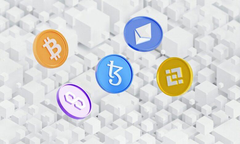 a group of colorful bitcoins sitting on top of a white background