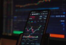 black android smartphone on brown wooden table