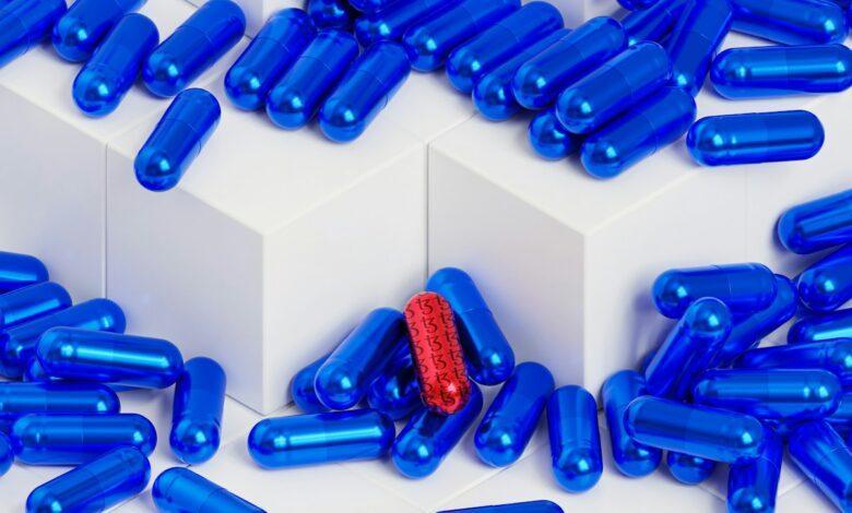 a bunch of blue pills sitting on top of each other